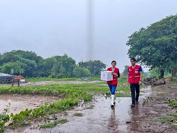 Volunteers with relief goods in flood region
