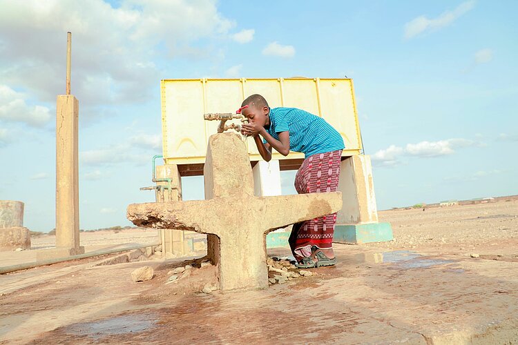 Boy at well in Somalia