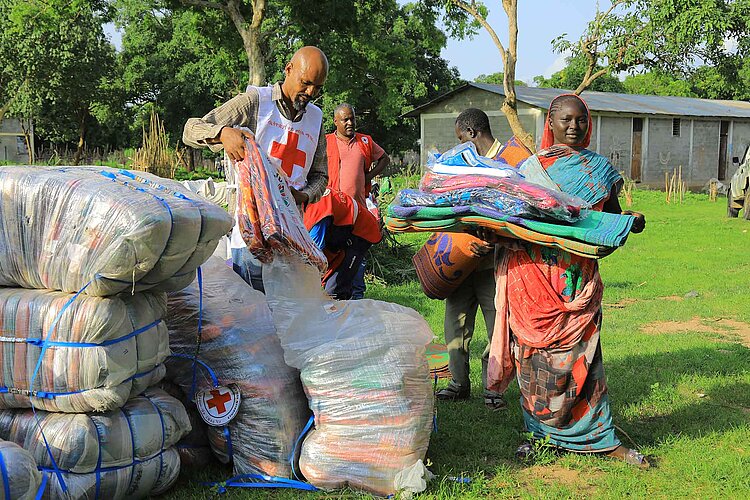 Woman receiving blankets
