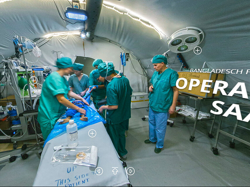 medical staff in operating room in tent