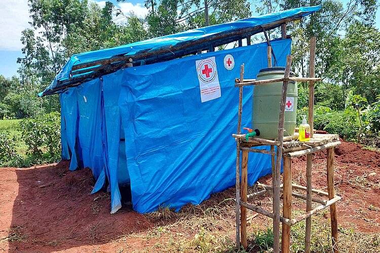 Latrine with blue tarpaulins