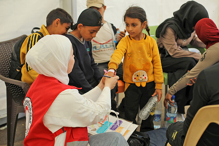 volunteer interacting with girl